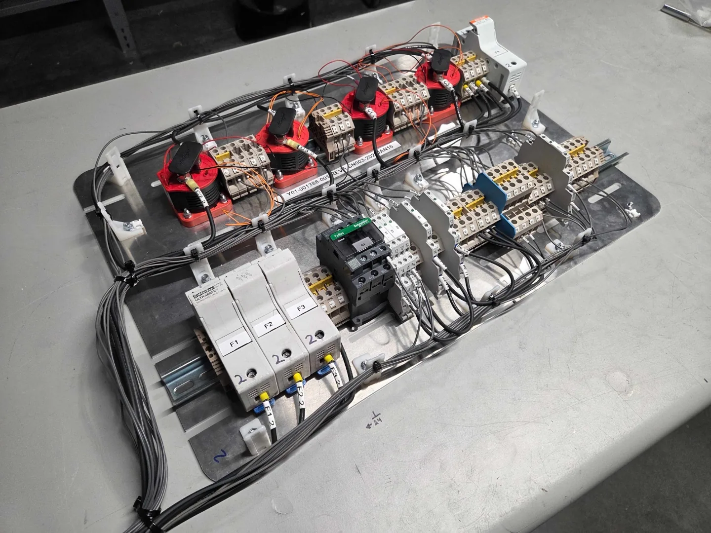 Power distribution panel with contactors, fuses, and current transformers